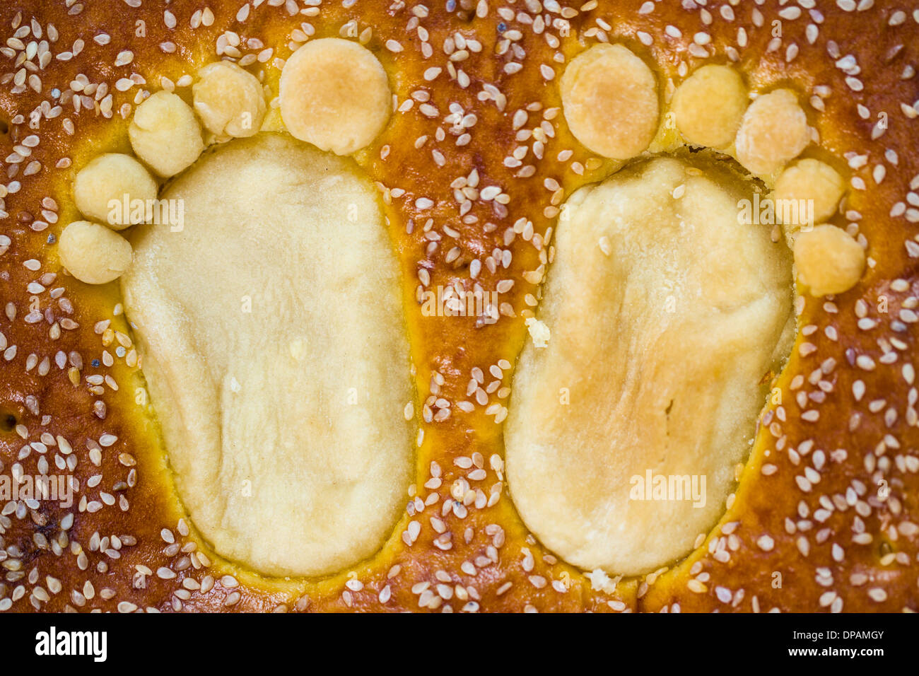 Child footprints on bap. Celebration of child birthday. Stock Photo