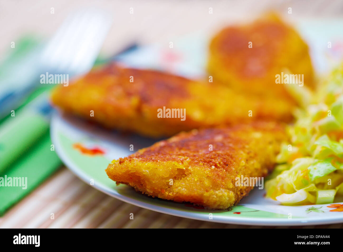 Breaded chicken meat with green salad Stock Photo Alamy
