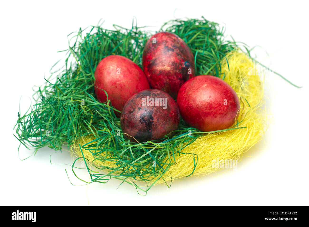 Easter eggs in nest isolated on white background Stock Photo - Alamy