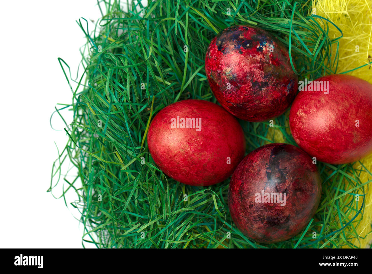 Easter eggs in nest isolated on white background Stock Photo - Alamy