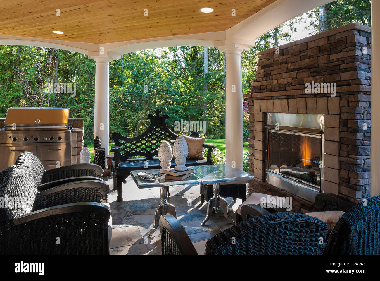 Outdoor Area In Back Yard Of Luxury Home Showing Outside Fireplace