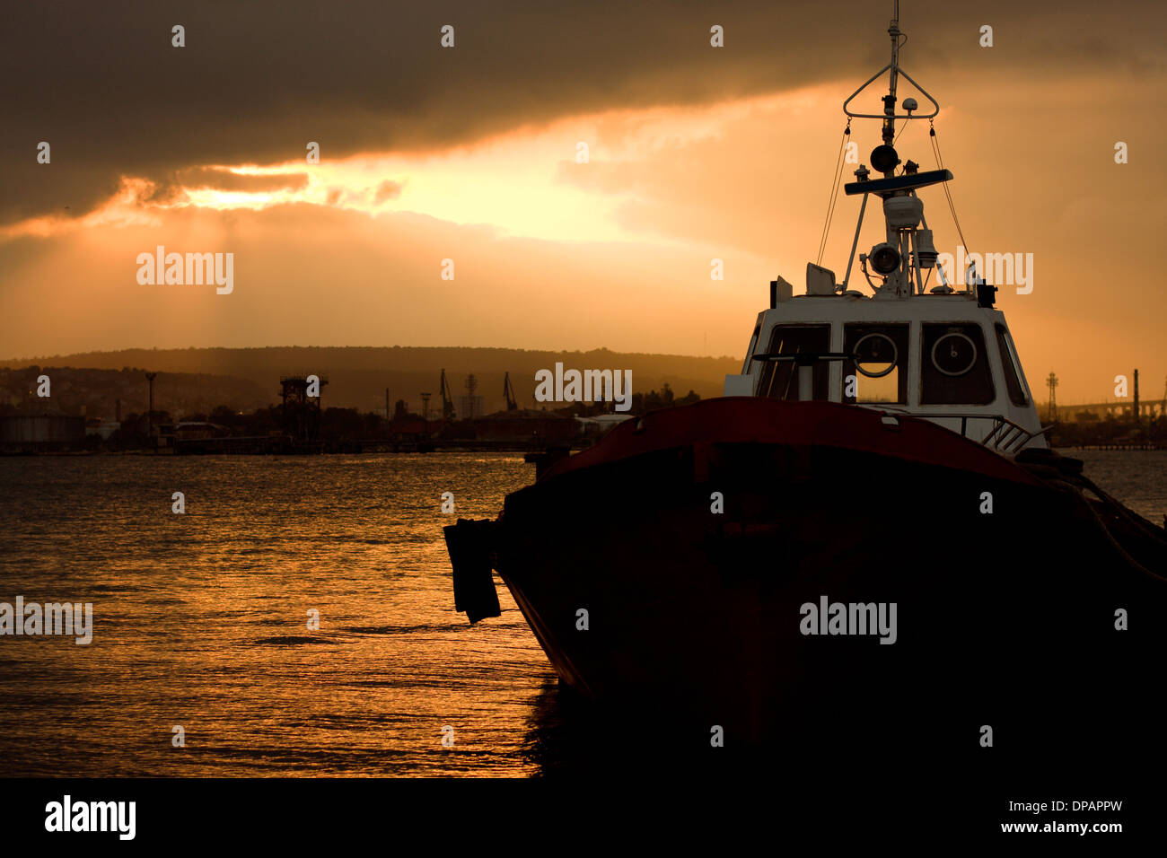 Ship in the sea at sunset Stock Photo - Alamy