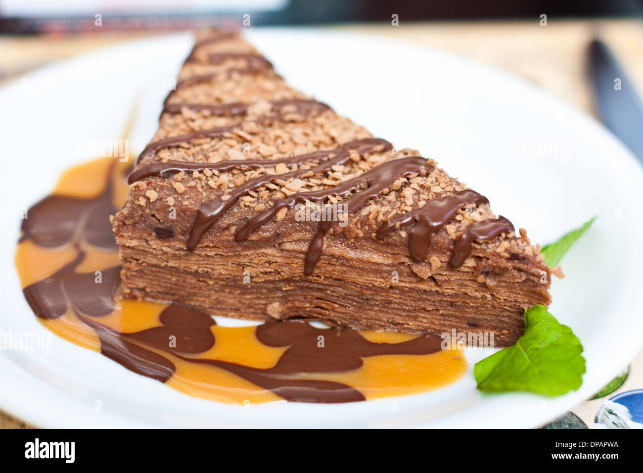 chocolate cake on a plate with butter and caramel cream Stock Photo - Alamy