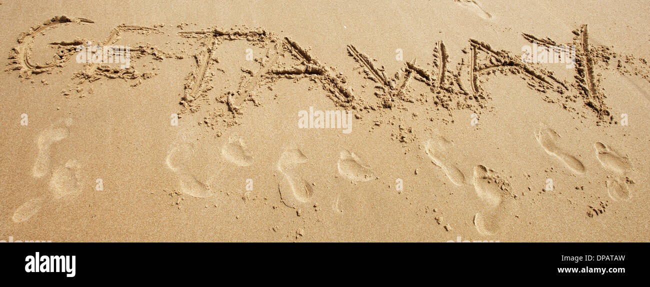 Message or greeting written in sand at the beach Stock Photo