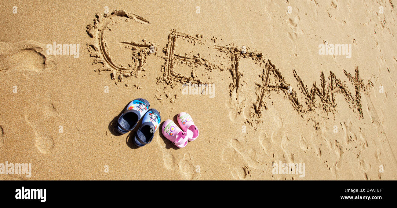 Messages and words written in the sand on a beach. Topical for travel agents and holidays Stock Photo