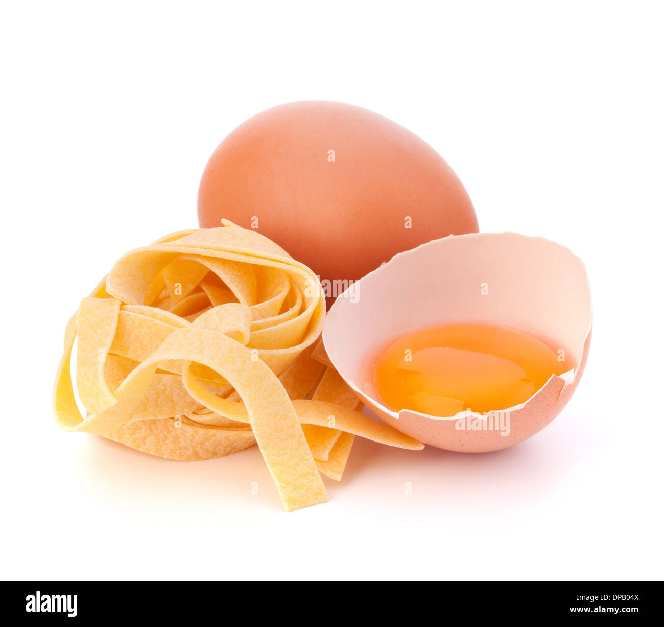 Italian egg pasta fettuccine nest isolated on white background Stock