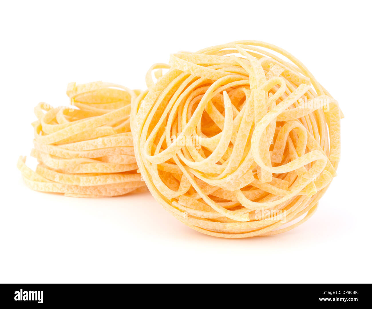 Italian pasta tagliatelle nest isolated on white background Stock Photo