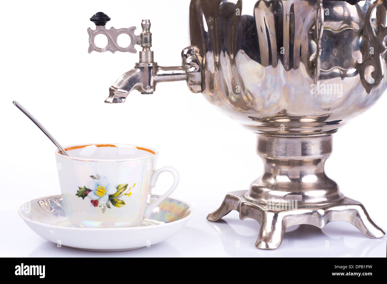 Traditional russian tea kettle-samovar and teacup Stock Photo