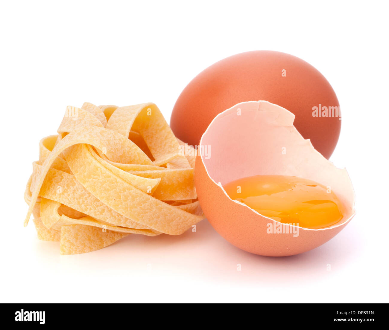 Italian egg pasta fettuccine nest isolated on white background Stock