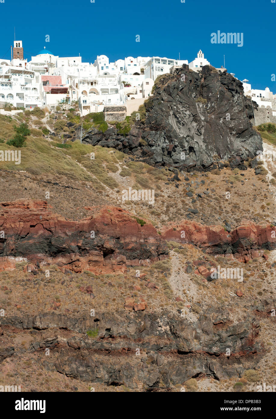 View of the houses of Imerovigli and rock face on the Greek island of Santorini. Stock Photo