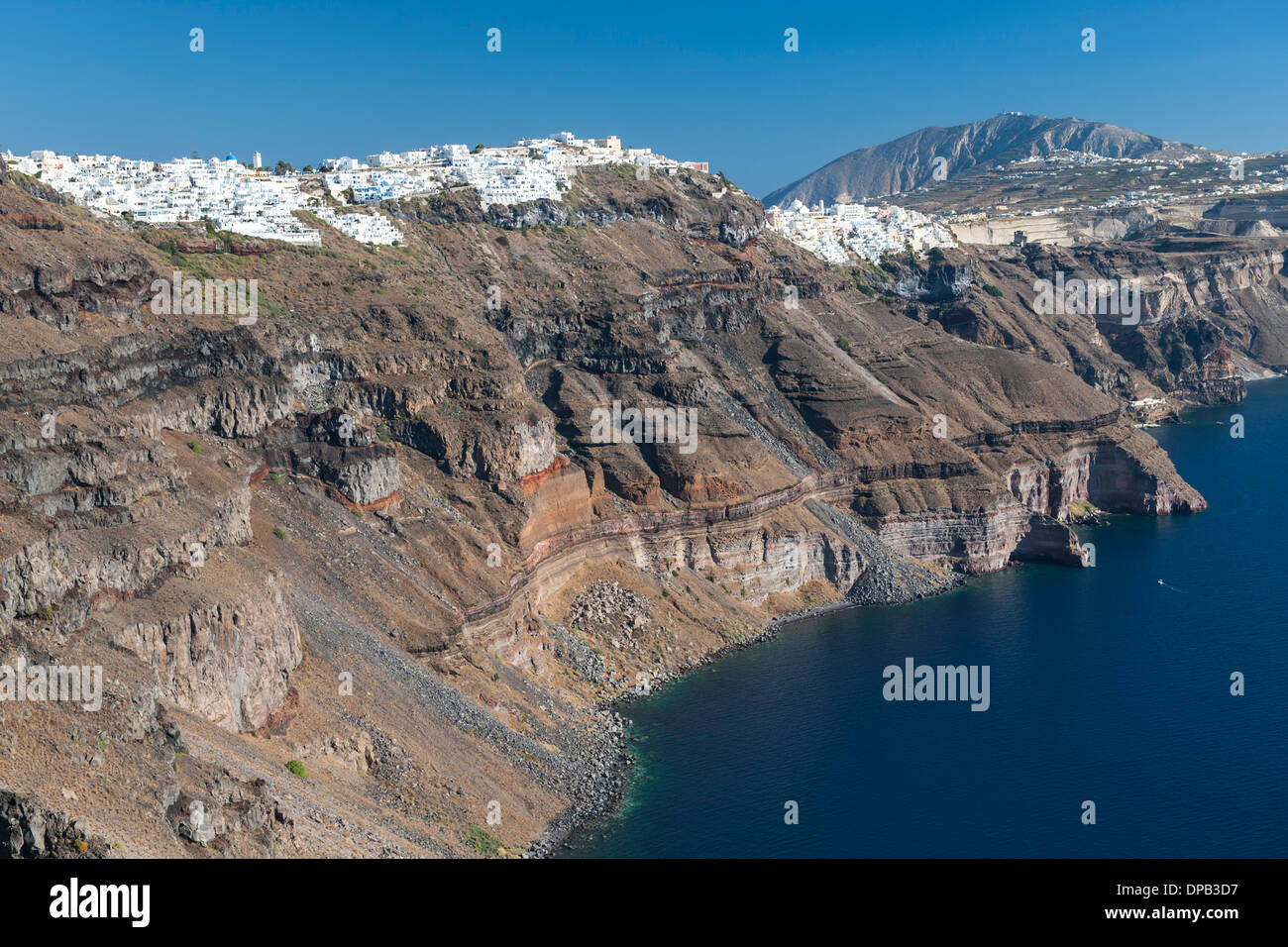 View of the coastline and houses of Fira and Firostefani on the Greek island of Santorini. Stock Photo