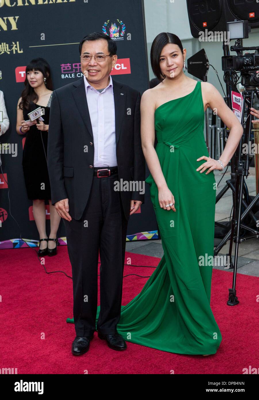 Los Angeles, USA. 10th Jan, 2014. Li Dongsheng (L), TCL chairman and CEO, and actress Michelle Chen arrive for the Hollywood TCL Microcinema Award Ceremony at TCL Chinese Theater in Los Angeles, the United States, Jan. 10, 2014. © Zhao Hanrong/Xinhua/Alamy Live News Stock Photo