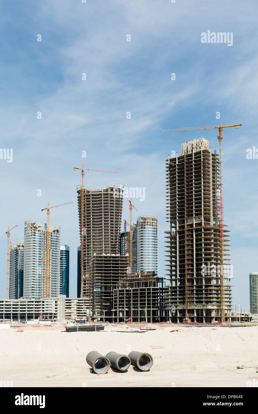 Many high-rise office and apartment towers under construction for new City of Lights at Al Reem Island new CBD in Abu Dhabi UAE Stock Photo