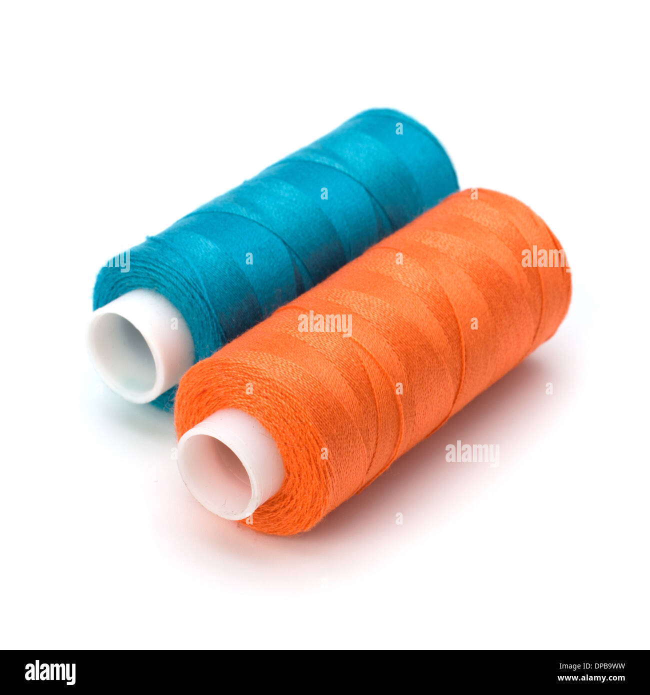 Colourful spools of thread isolated on white background Stock Photo - Alamy