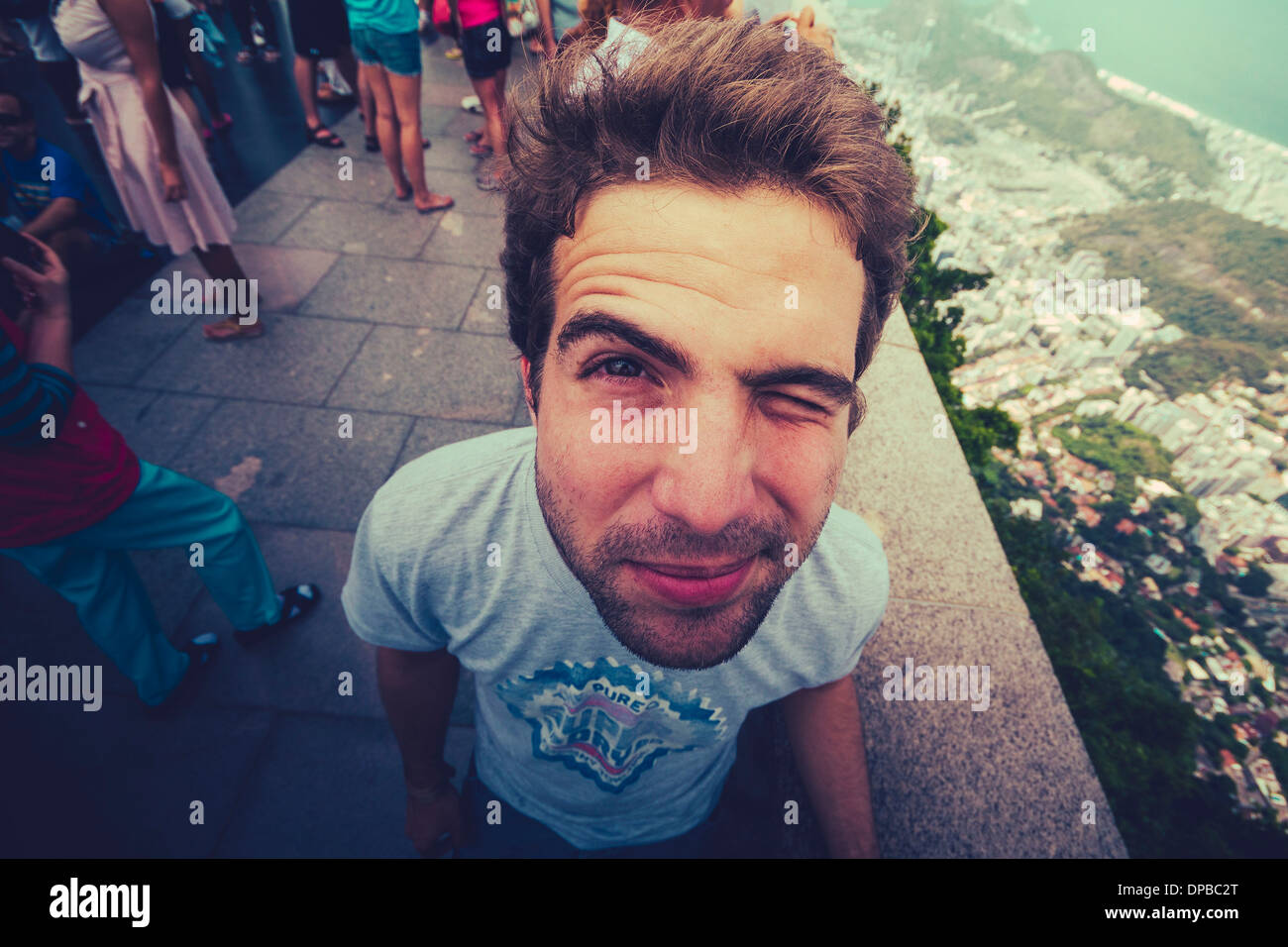 Brazil, Rio de Janeiro, Corcovado, Man twinkling his eye Stock Photo ...