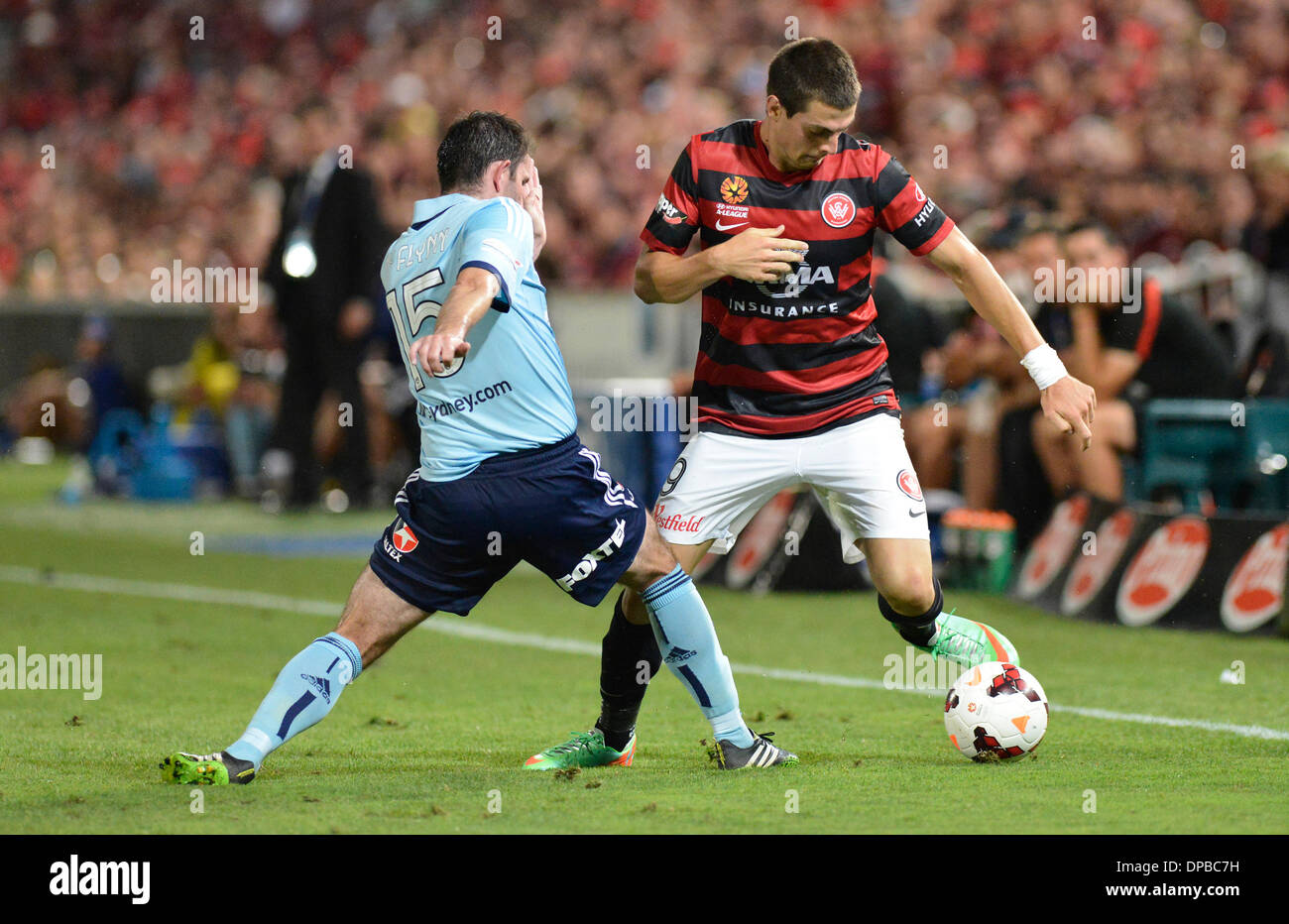Sydney, Australia. 11th Jan, 2014. Sydney midfielder Terry McFlynn and Wanderers forward Tomi Juric in action during the Hyundai A League game between Western Sydney Wanderers FC and Sydney FC from the Pirtek Stadium, Parramatta. Credit:  Action Plus Sports/Alamy Live News Stock Photo