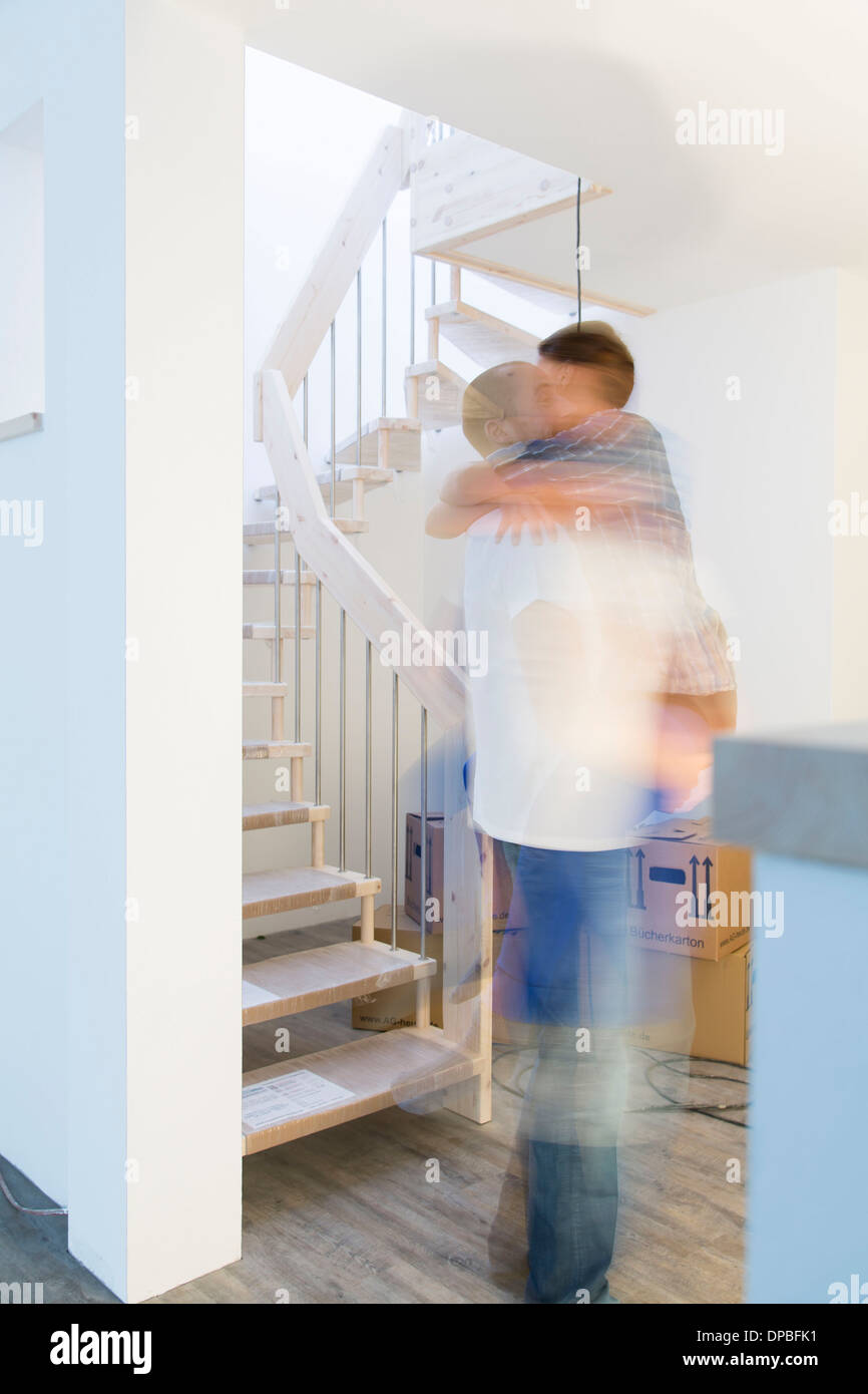 Happy young couple in new home Stock Photo - Alamy