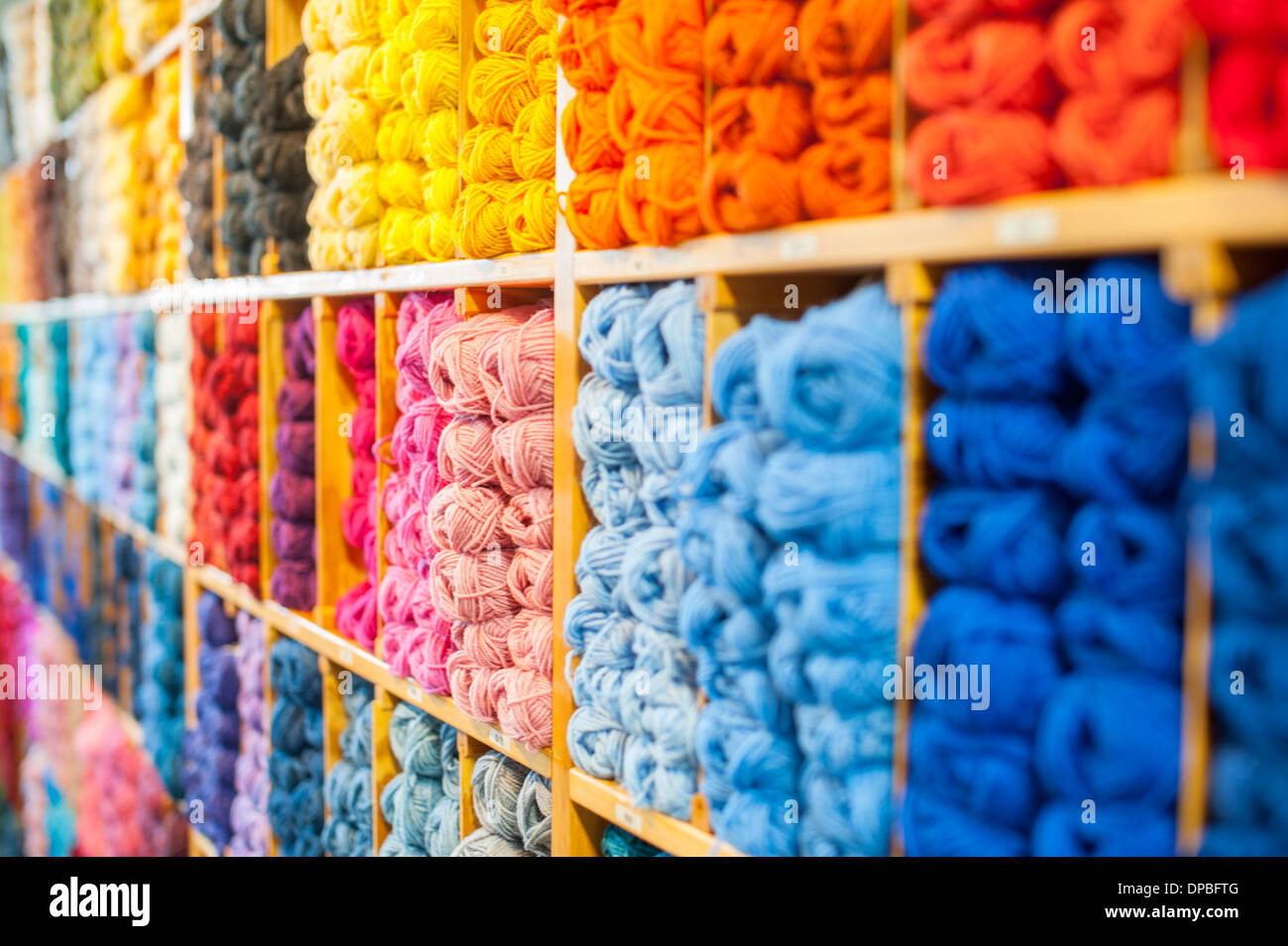Yarn in multiple colors at sales stand Stock Photo Alamy