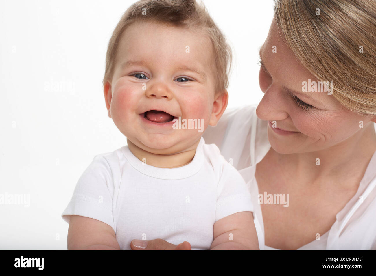 Smiling baby boy and his mother Stock Photo
