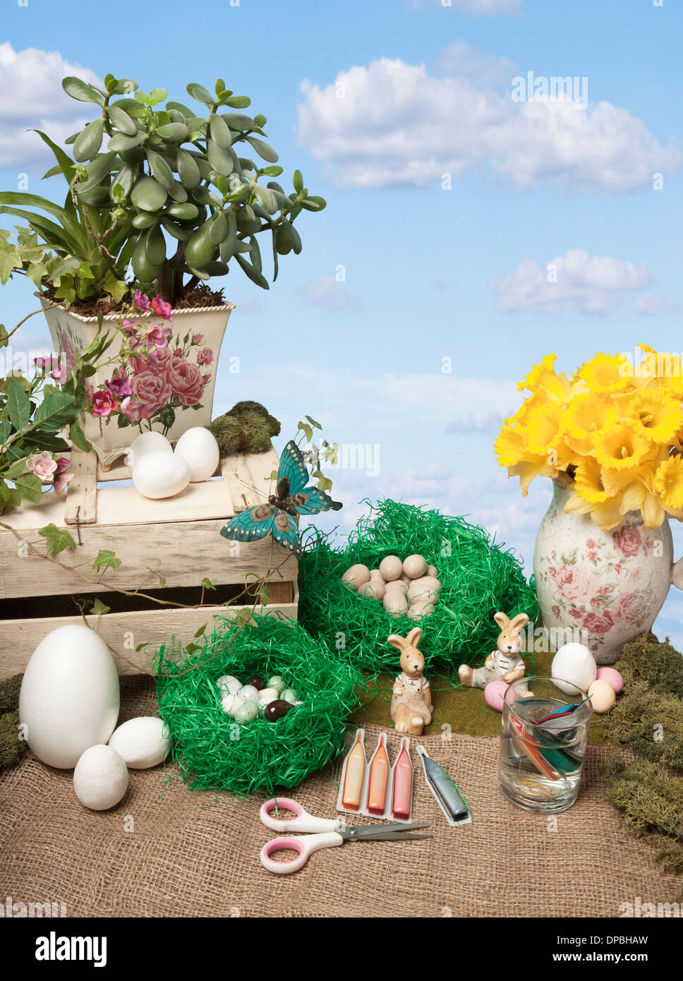 easter arts and crafts, with different easter eggs and easter bunnies, on background blue sky Stock Photo