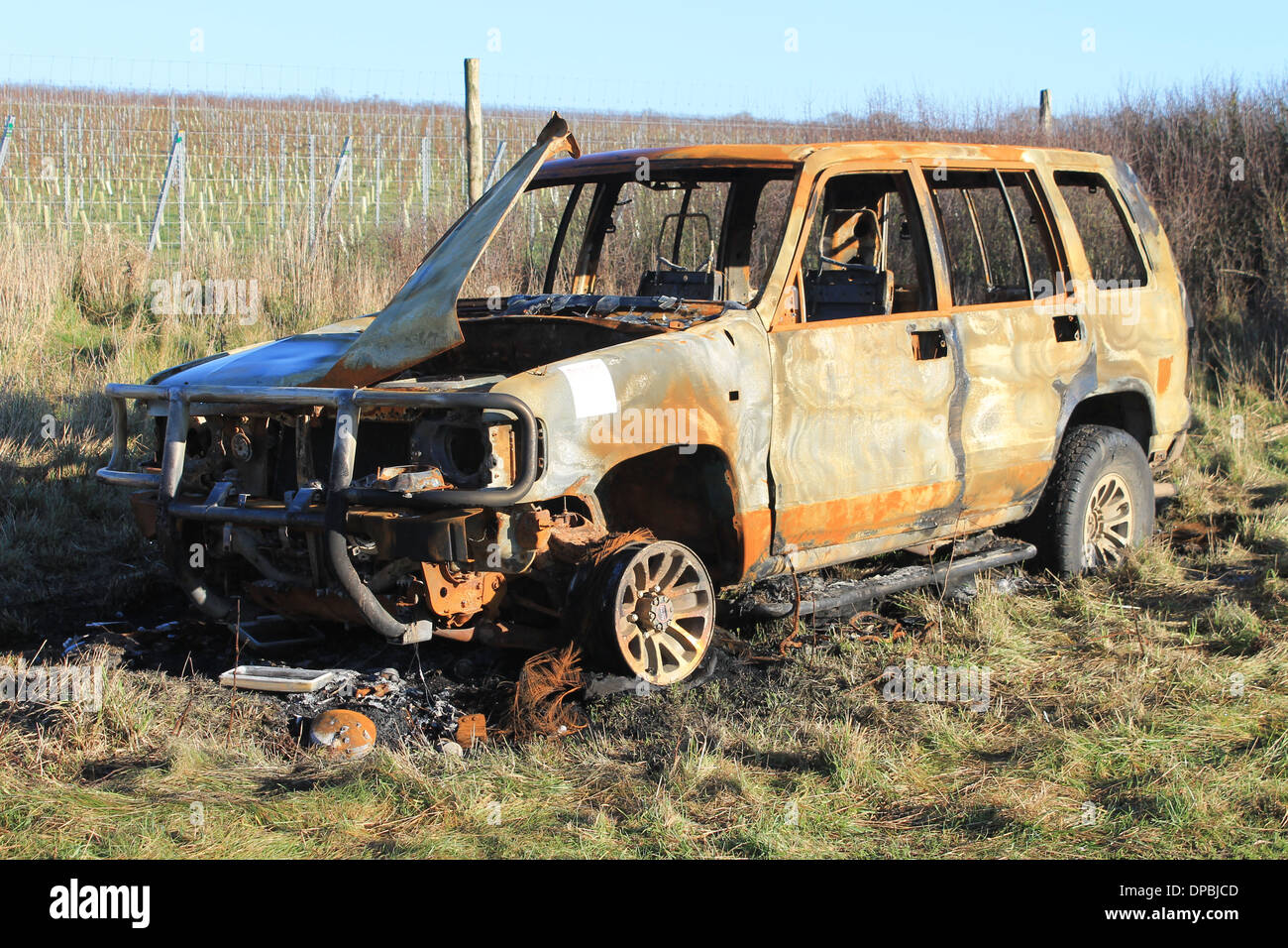 Front and side elevation detail of a torched Range Rover abandoned in ...