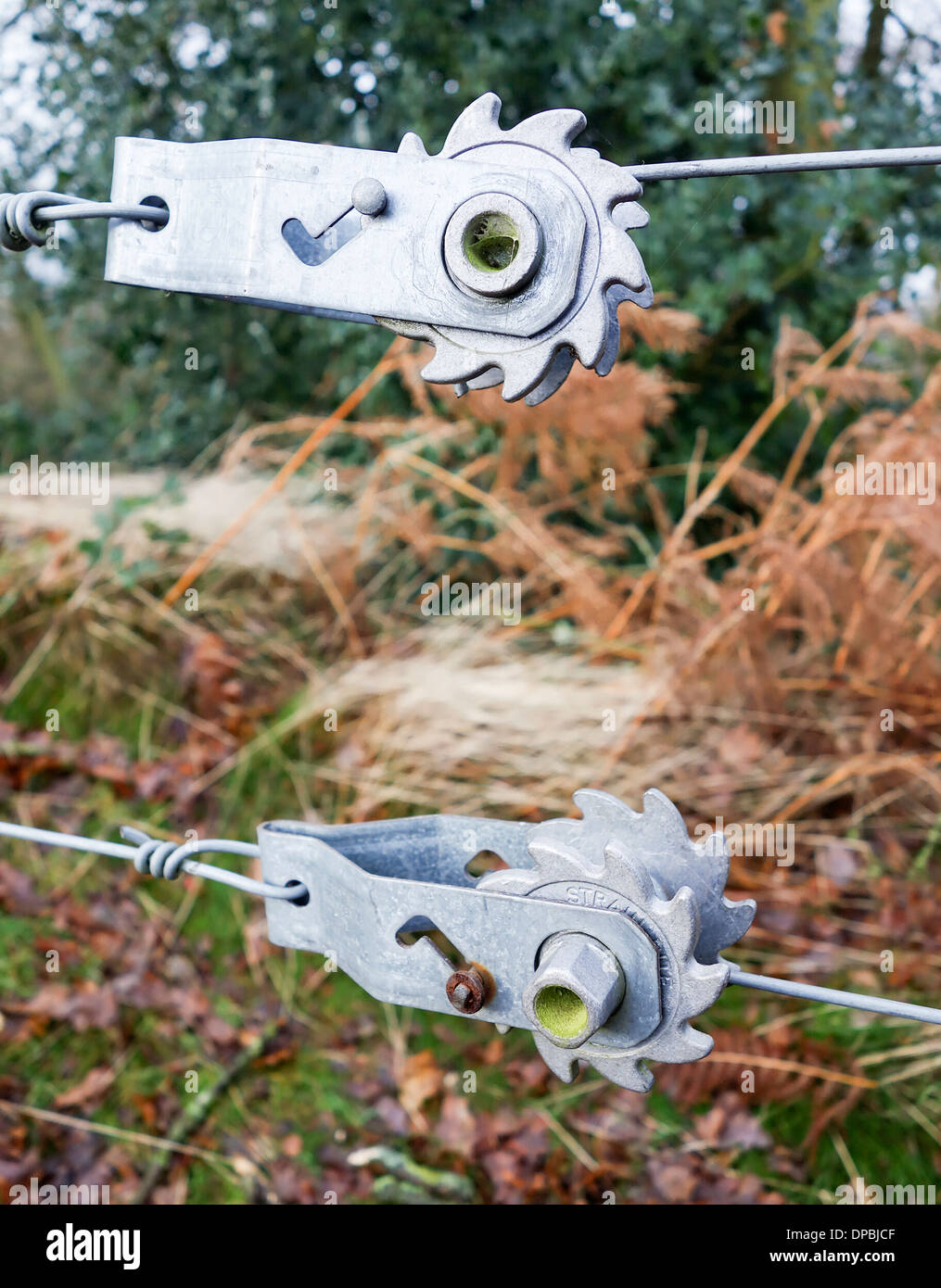 Wire fence ratchet type tensioner used to join two ends of the wire together Stock Photo
