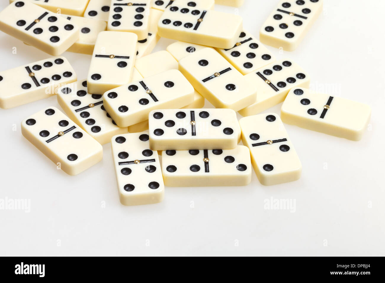 scattered dominoes on white background close up Stock Photo