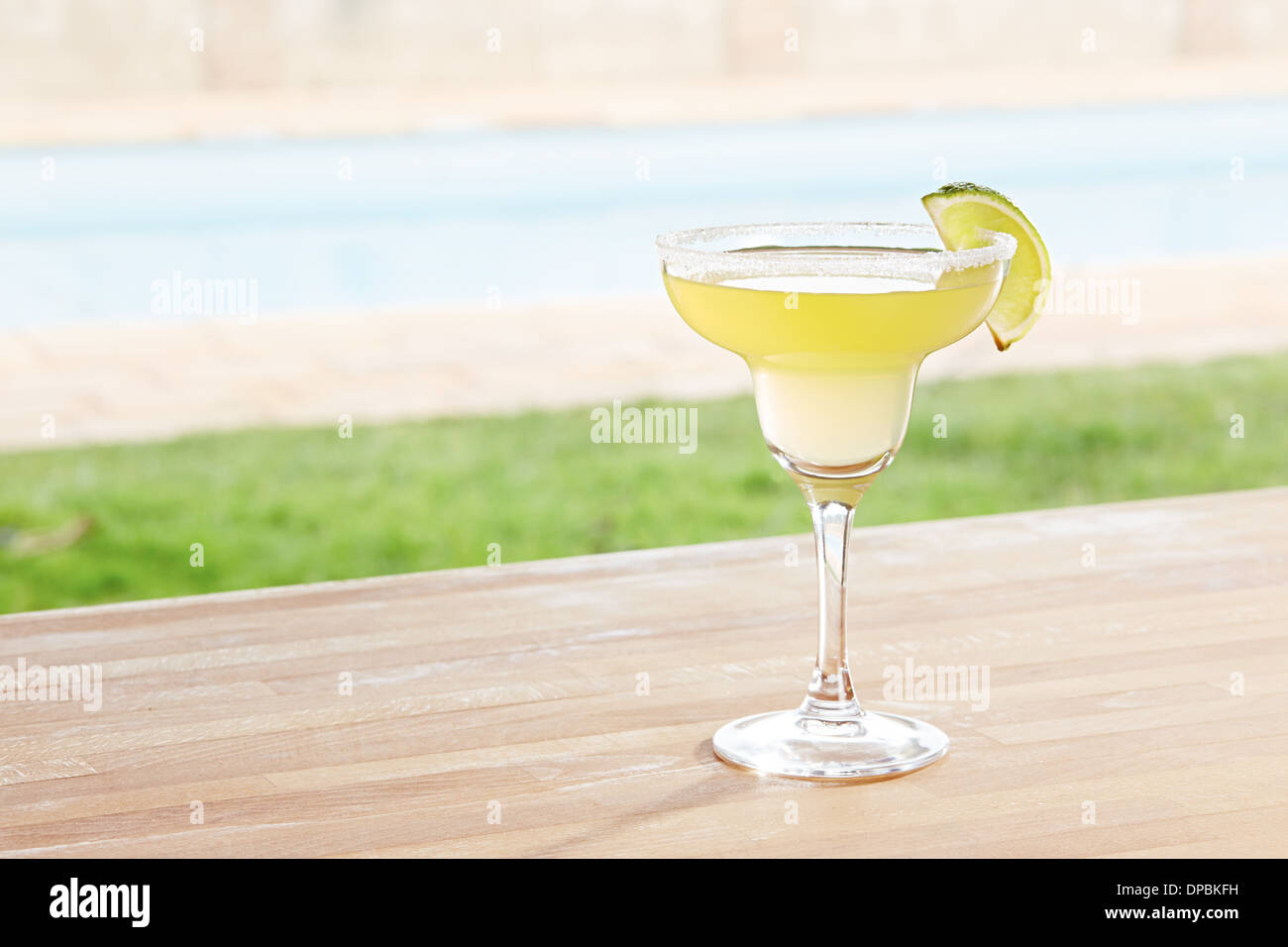 Margarita cocktail on poolside bar Stock Photo