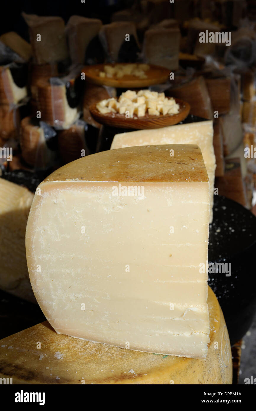 Parmesan and other hard cheeses on display in the annual All Saints Market in Cocentaina, Alicante province, Spain Stock Photo