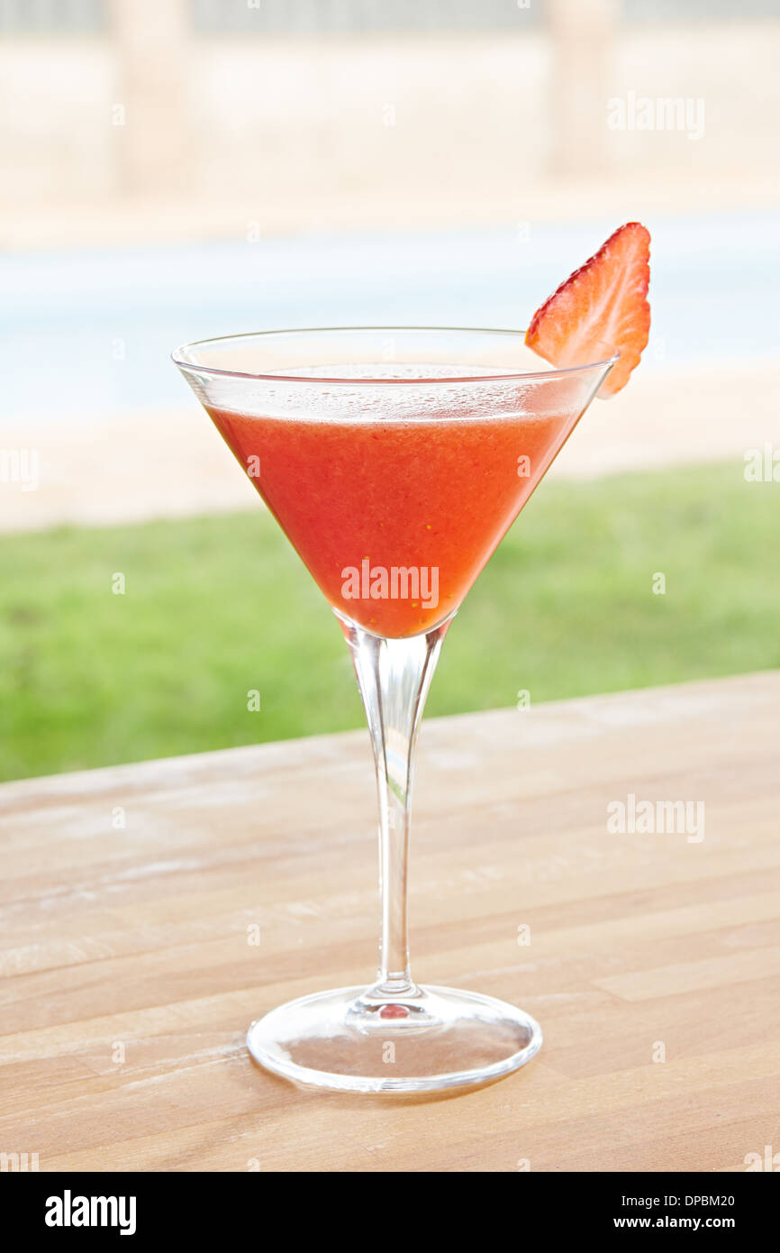 Strawberry daiquiri cocktail on poolside bar Stock Photo Alamy