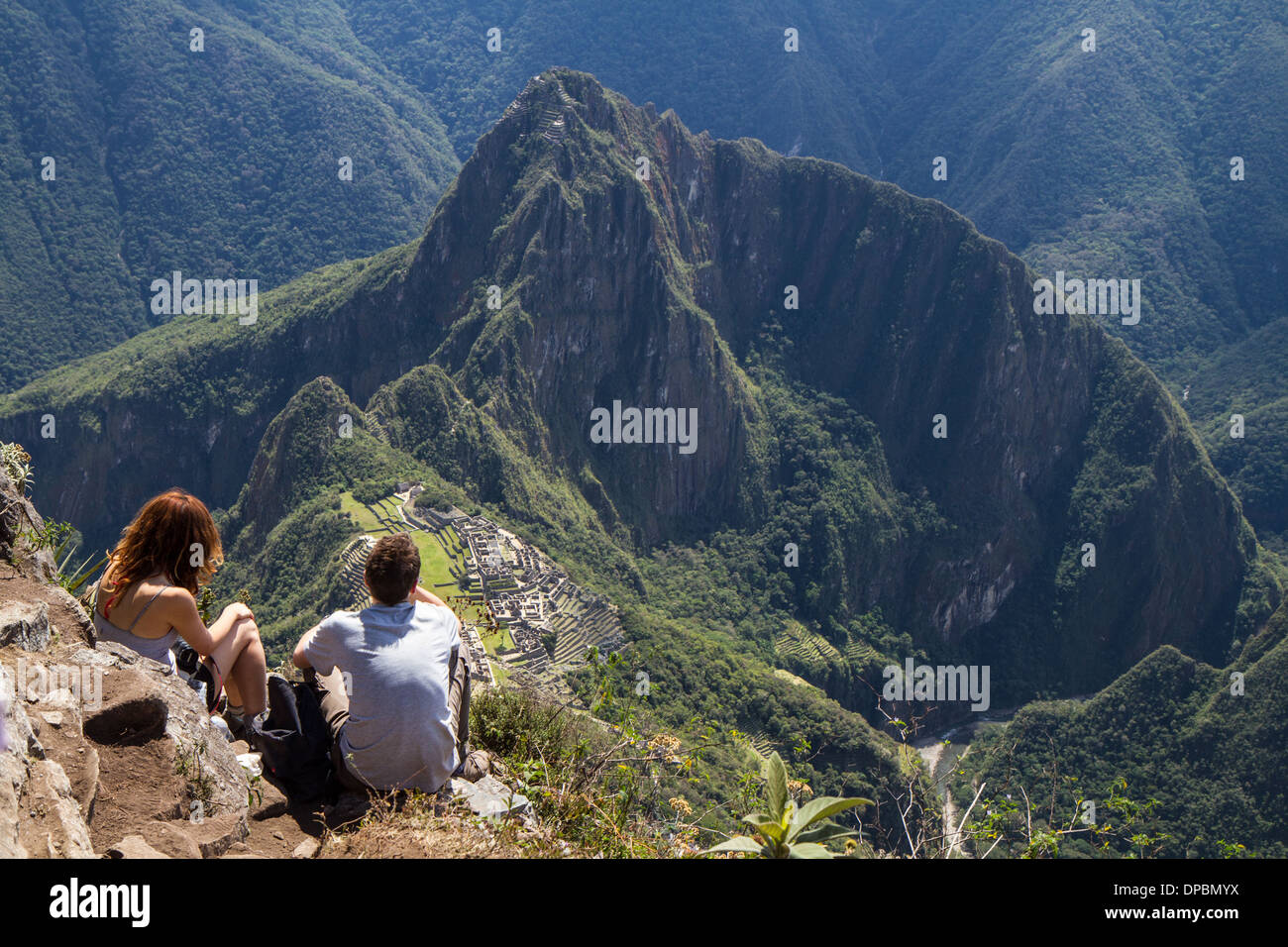 Hikers on the top of Machu picchu mountain, Peru Stock Photo