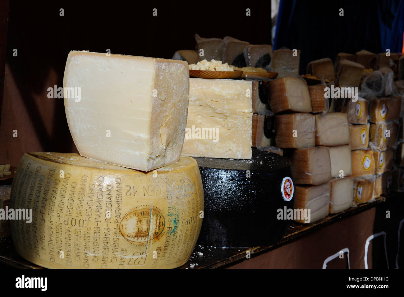 Parmesan and other hard cheeses on display in the annual All Saints Market in Cocentaina, Alicante province, Spain Stock Photo