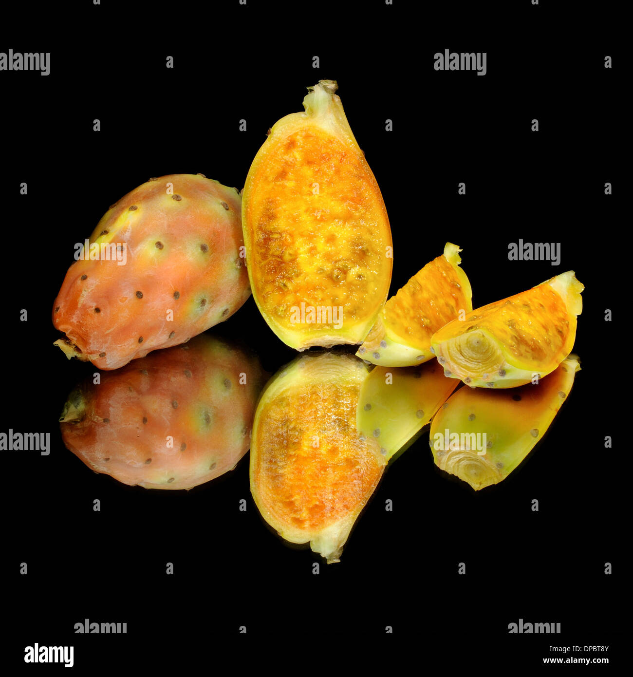 Prickly pears on mirror with black background. Fruit. Stock Photo