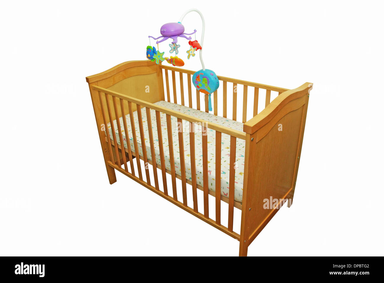 Baby's bed with a carousel isolated on white Stock Photo - Alamy