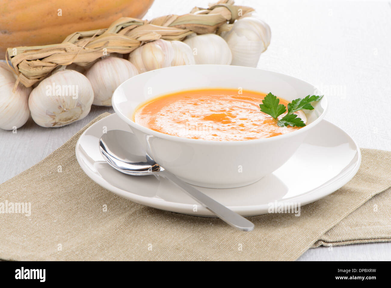 Pumpkin soup on white wood background Stock Photo - Alamy
