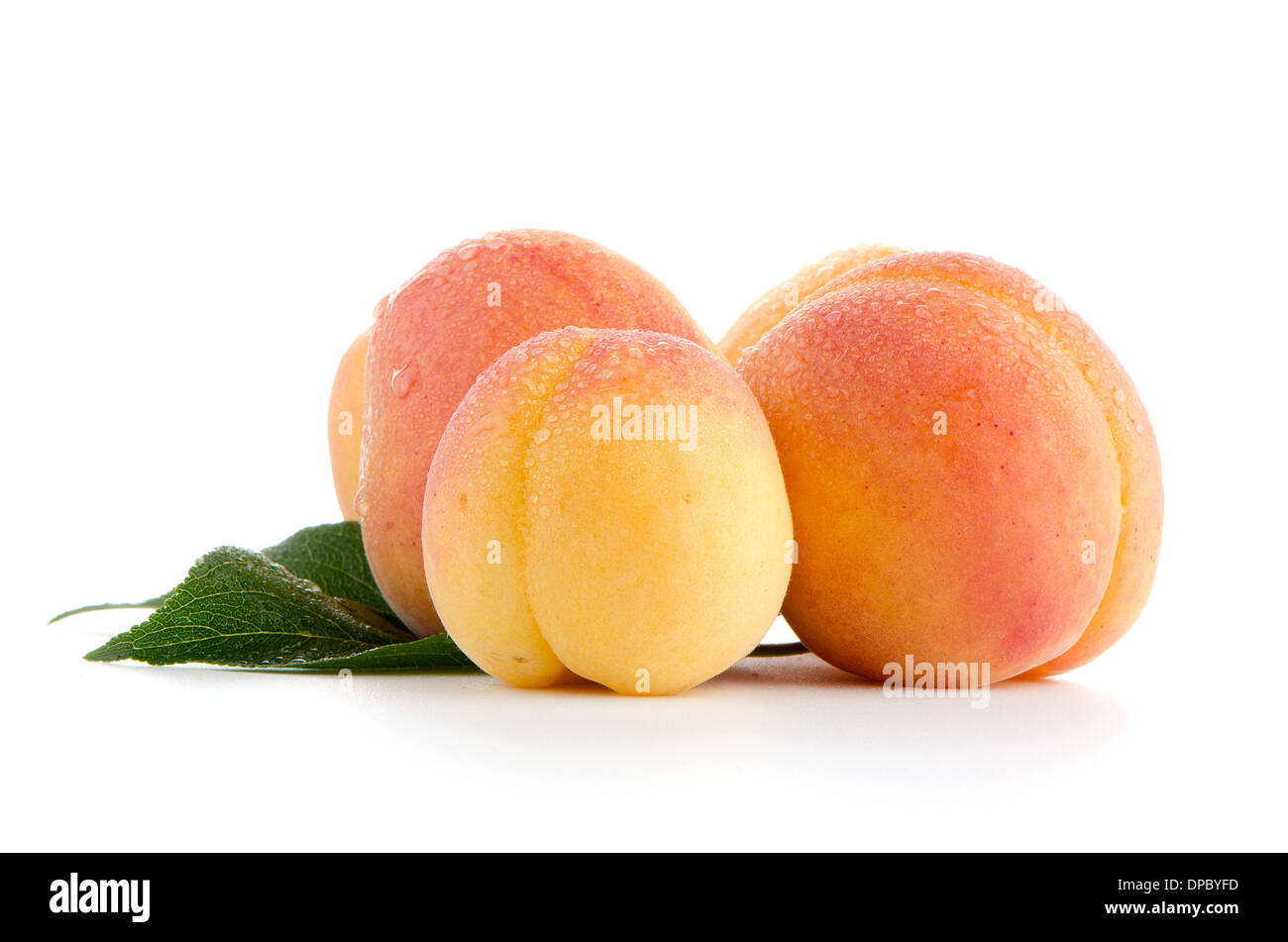 Sweet peaches with leafs on a white background Stock Photo