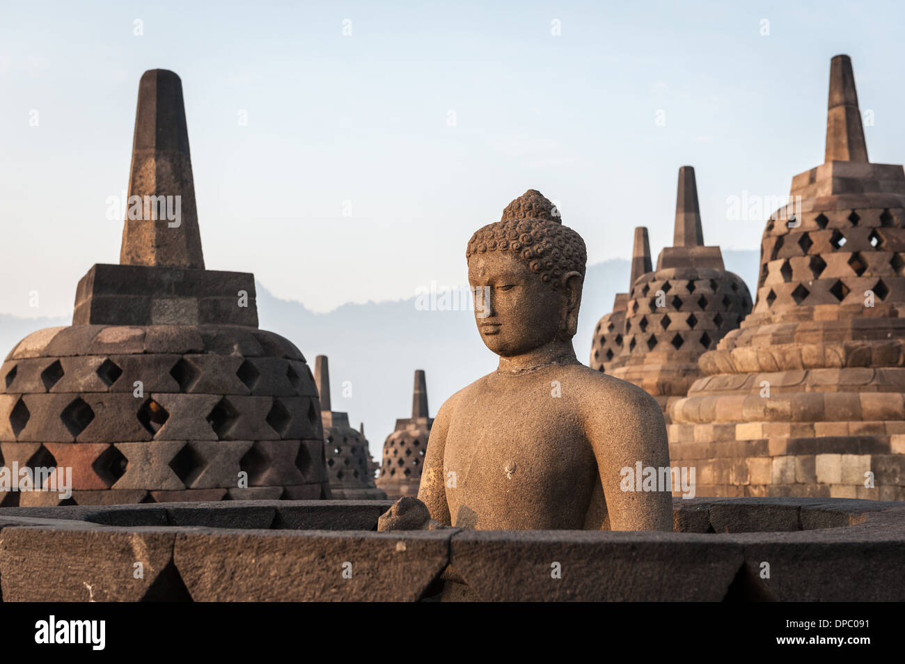 Sunrising over the stupas of the Buddhist temple of Borobudur, Java, Indonesia. Stock Photo