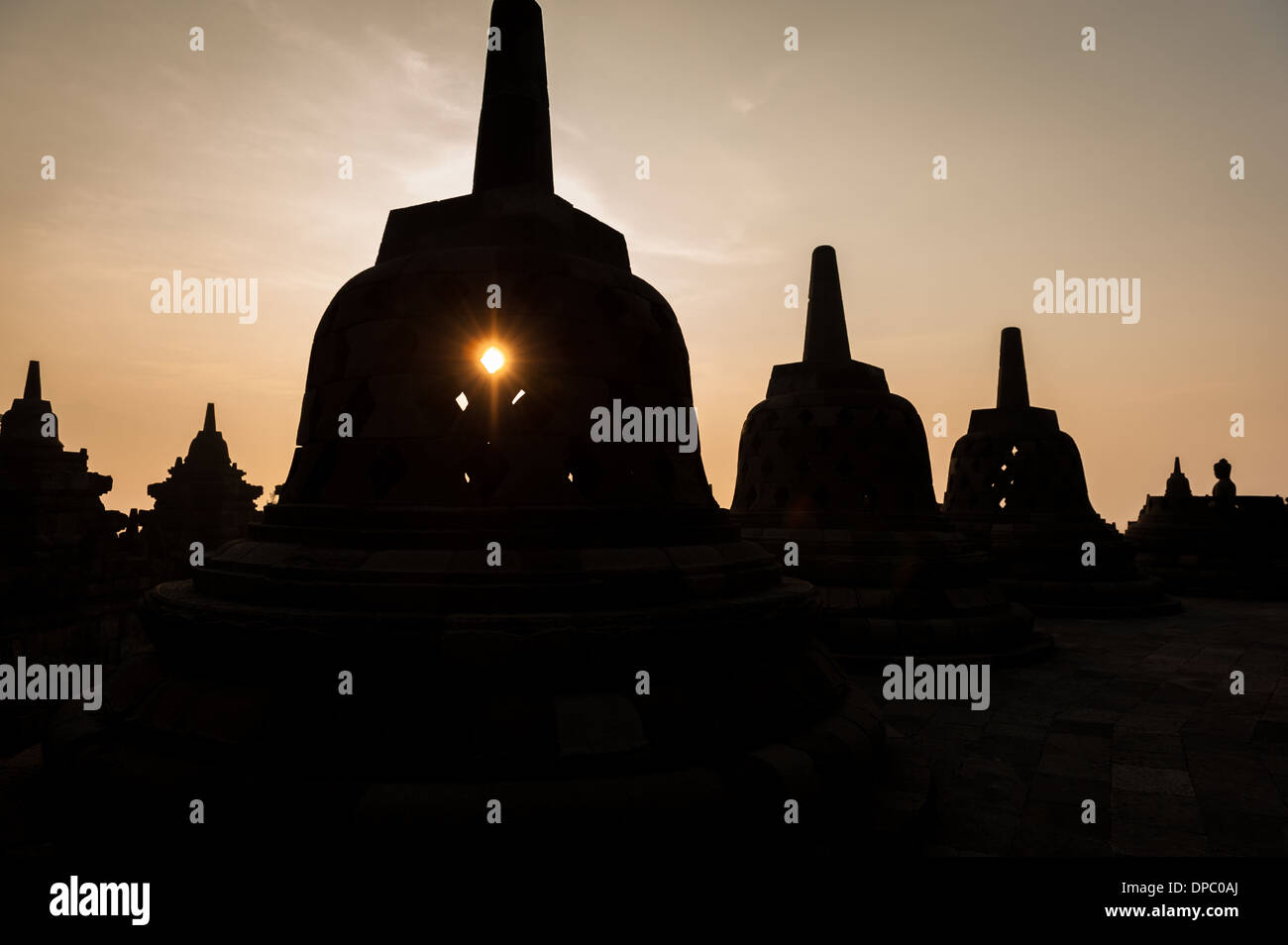 Sunrising over the stupas of the Buddhist temple of Borobudur, Java, Indonesia. Stock Photo