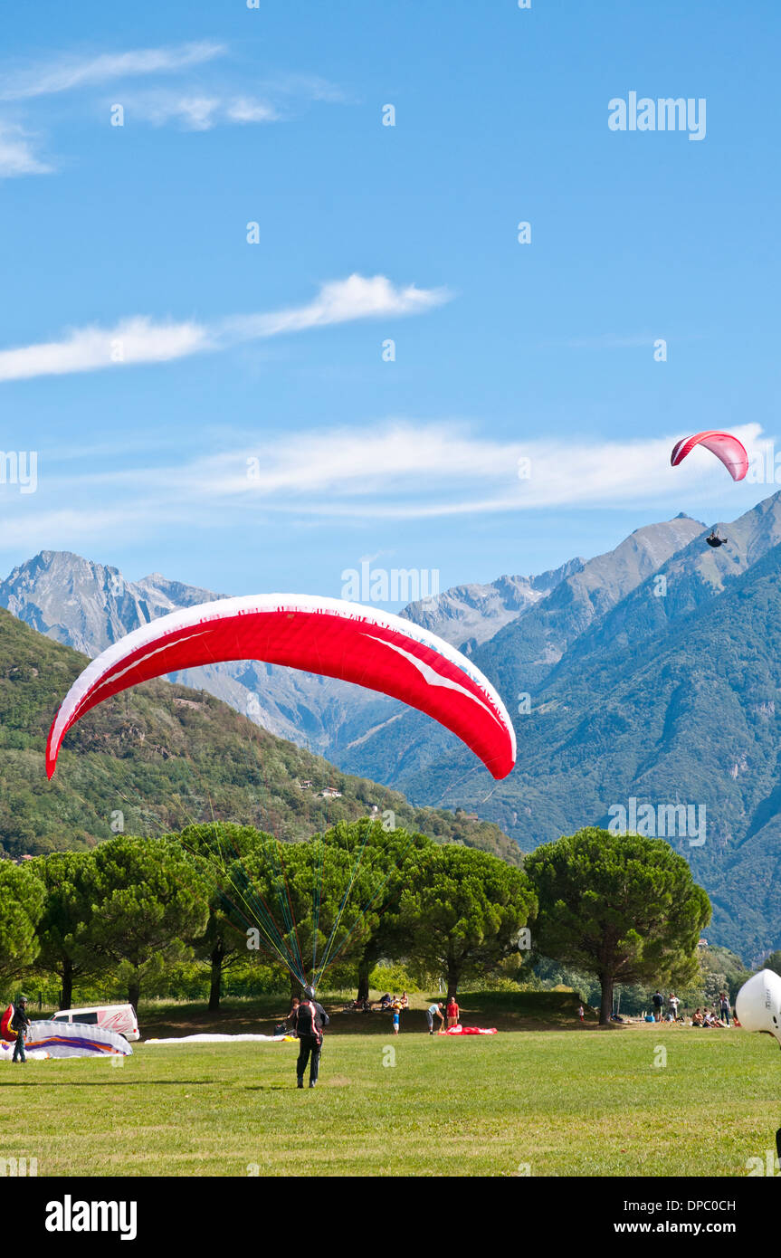 Paragliders landing in Sorico, Lake Como, Italy Stock Photo