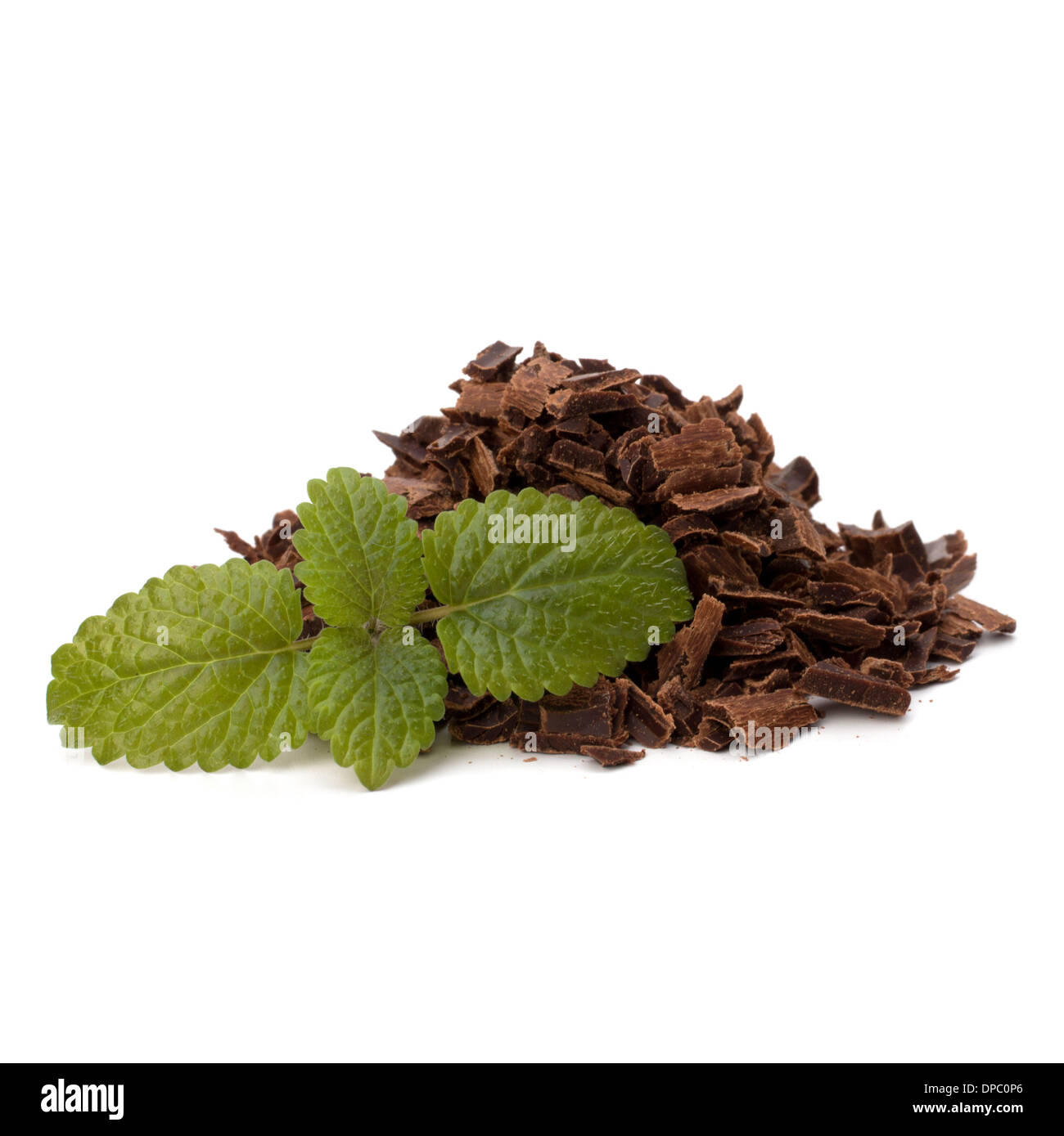 Crushed chocolate shavings pile and mint leaf isolated on white background Stock Photo
