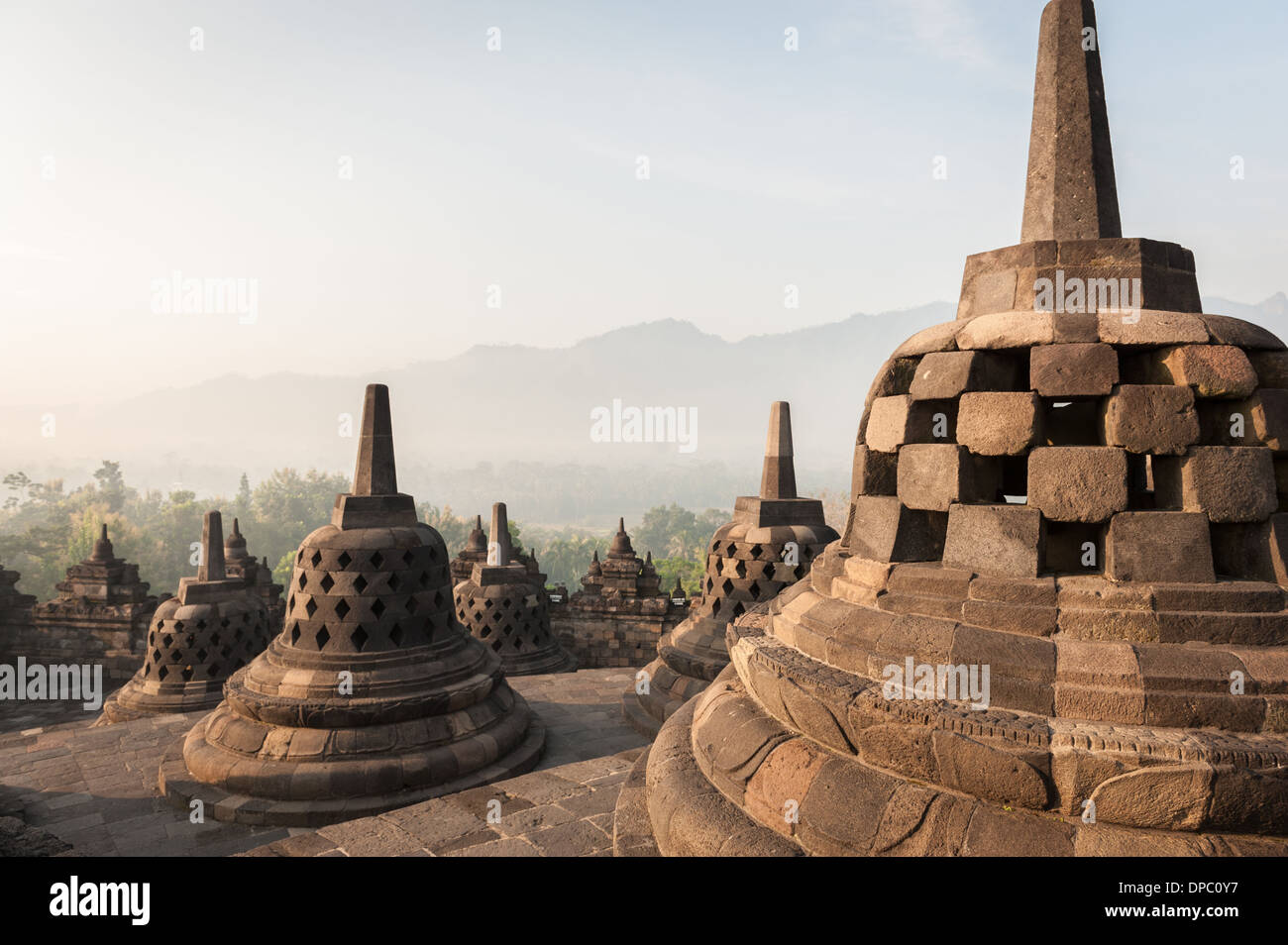 Sunrising over the stupas of the Buddhist temple of Borobudur, Java, Indonesia. Stock Photo