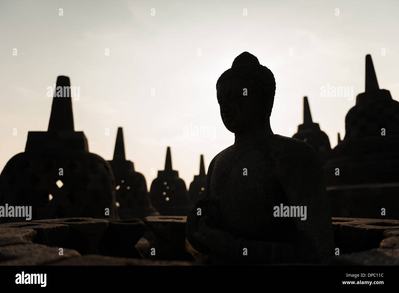 Sunrising over the stupas of the Buddhist temple of Borobudur, Java, Indonesia. Stock Photo