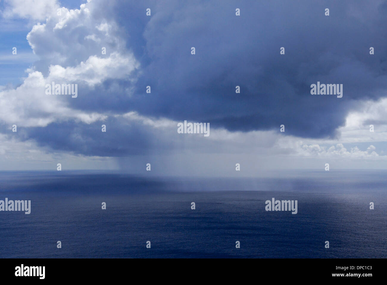 Rain squall over the Pacific Ocean off of Easter Island, Chile Stock Photo