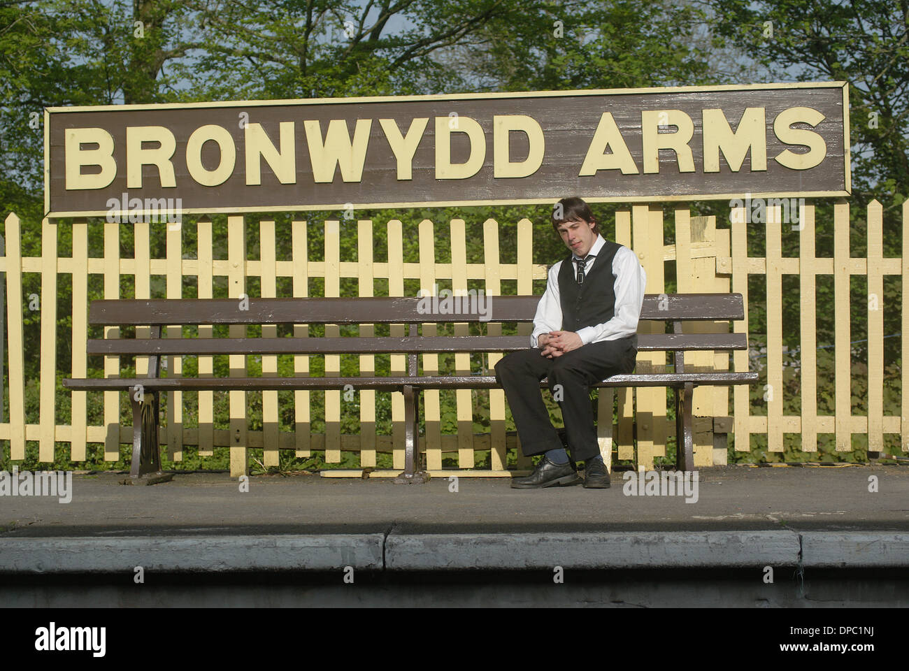 Gwilli Railway.   Railway bench  railway platform  man on railway bench   period railway Stock Photo