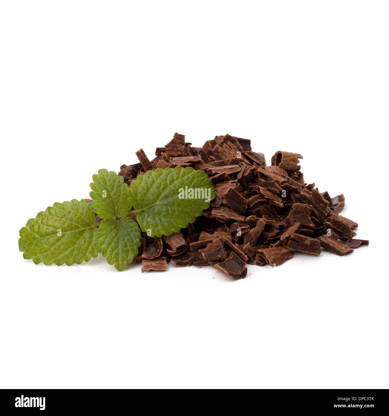 Crushed chocolate shavings pile and mint leaf isolated on white background Stock Photo