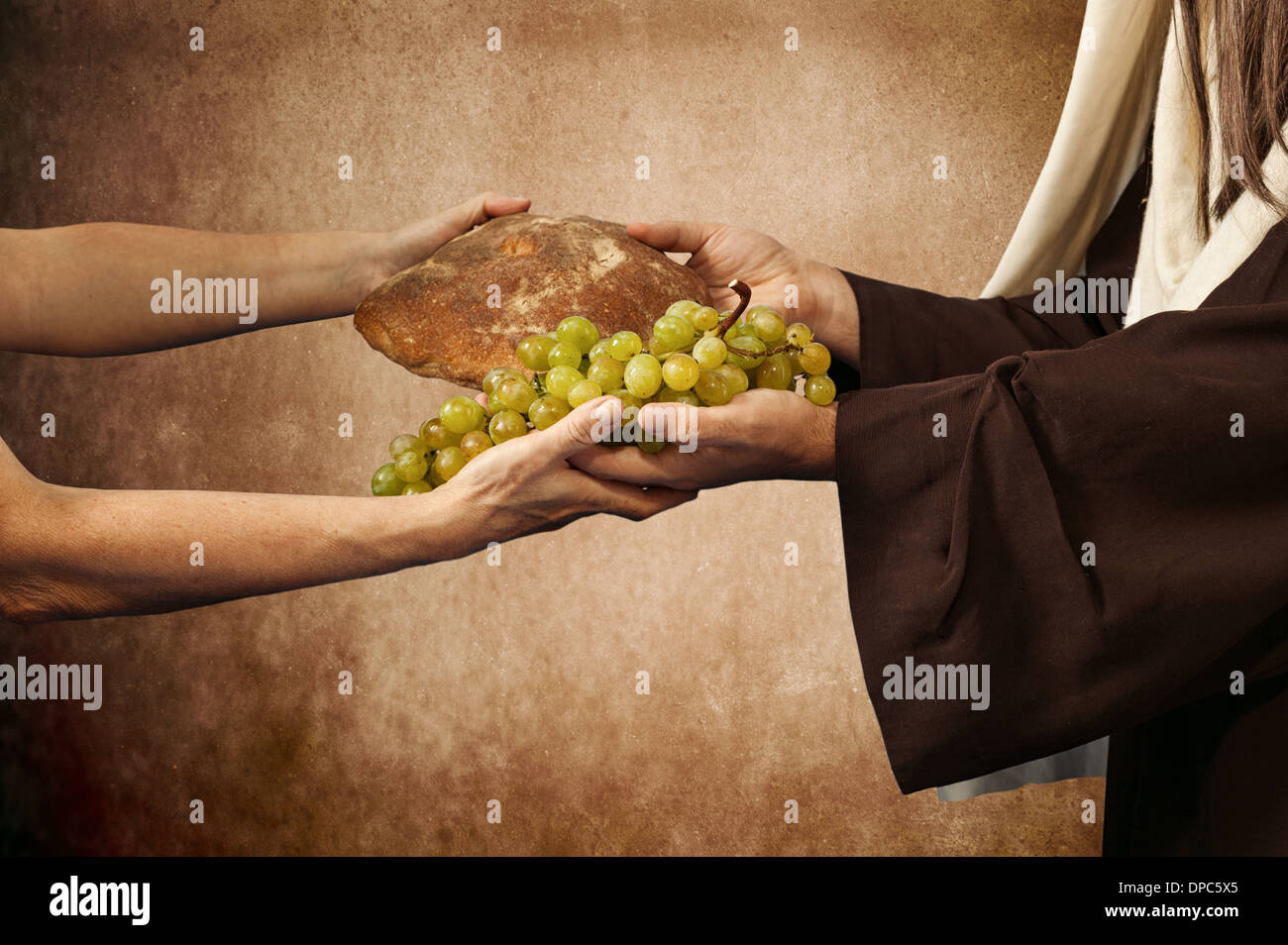 Jesus gives bread and grapes on beige background Stock Photo