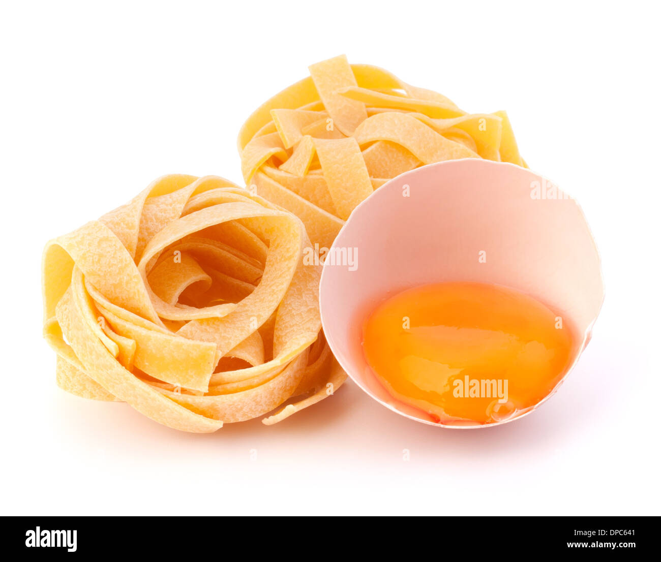 Italian egg pasta fettuccine nest isolated on white background Stock