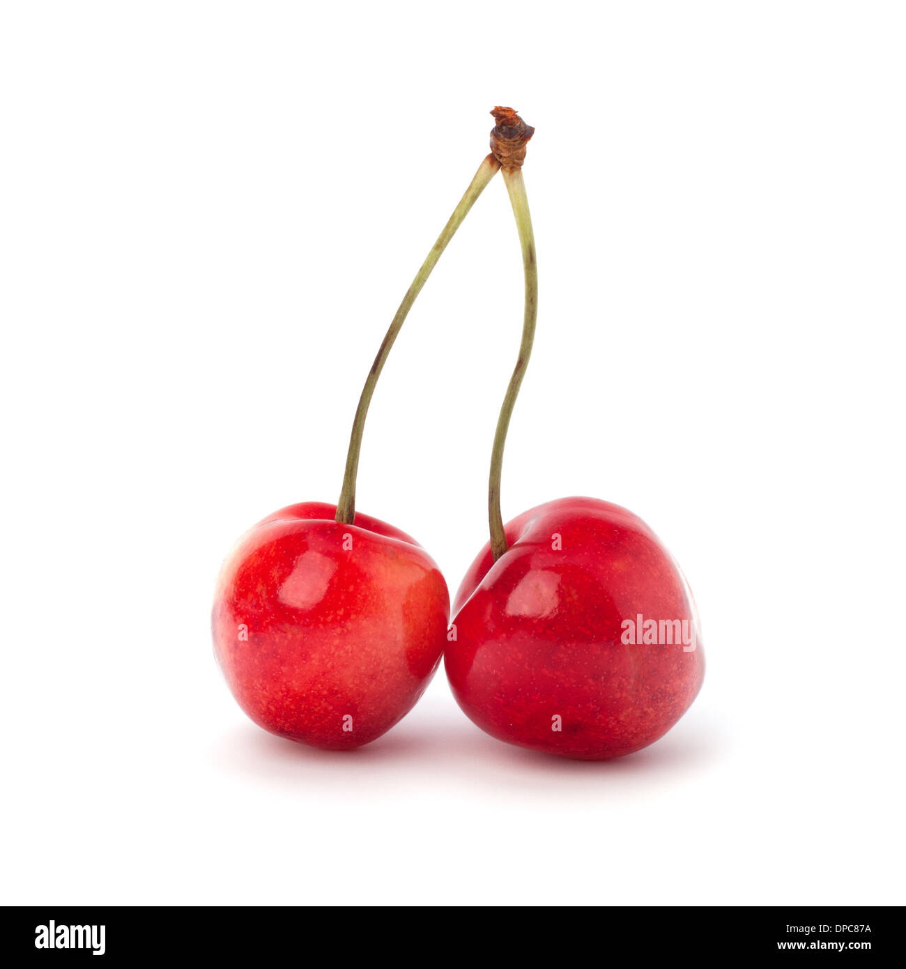 Two cherry berries isolated on white background Stock Photo - Alamy