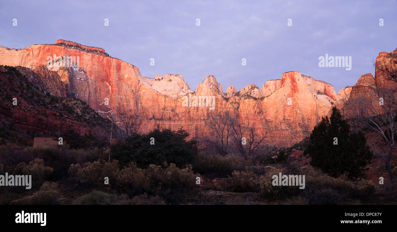 The light has not quite reached the valley int this vertical composition of early morning in the desert Southwest Stock Photo