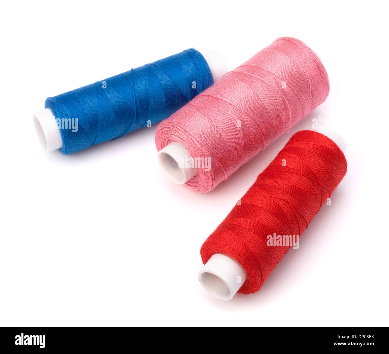 Colourful spools of thread isolated on white background Stock Photo - Alamy